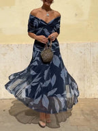 Belinda | Vestido elegante azul oscuro con estampado de hojas